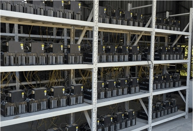 A vast data center filled with racks of mining machines, humming with computational power.
